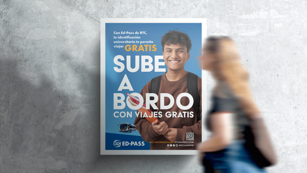 Woman walking in front of EdPass poster